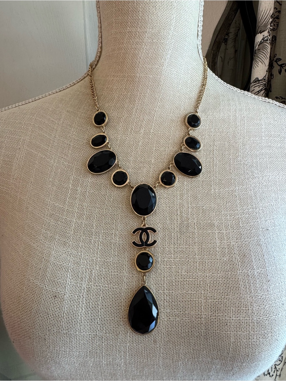 Bib Necklace with Black Faceted Drops and Iconic Pendant